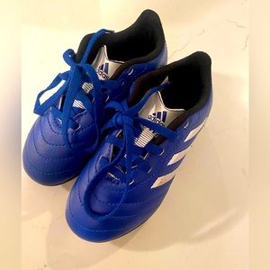 Bright blue Adidas Cleats